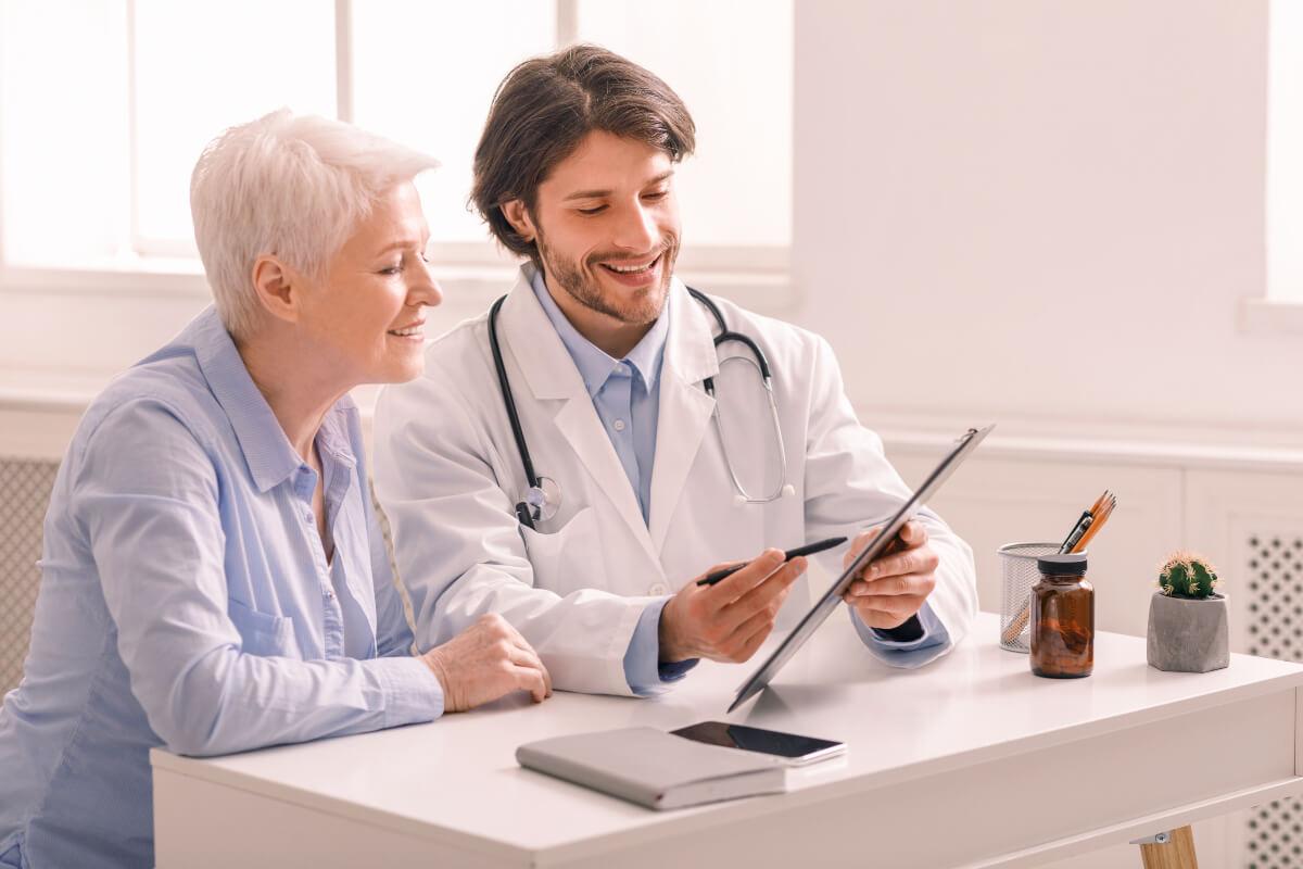 Doctor shows lab results to patient as engagement strategy to recover lost medical practice revenue