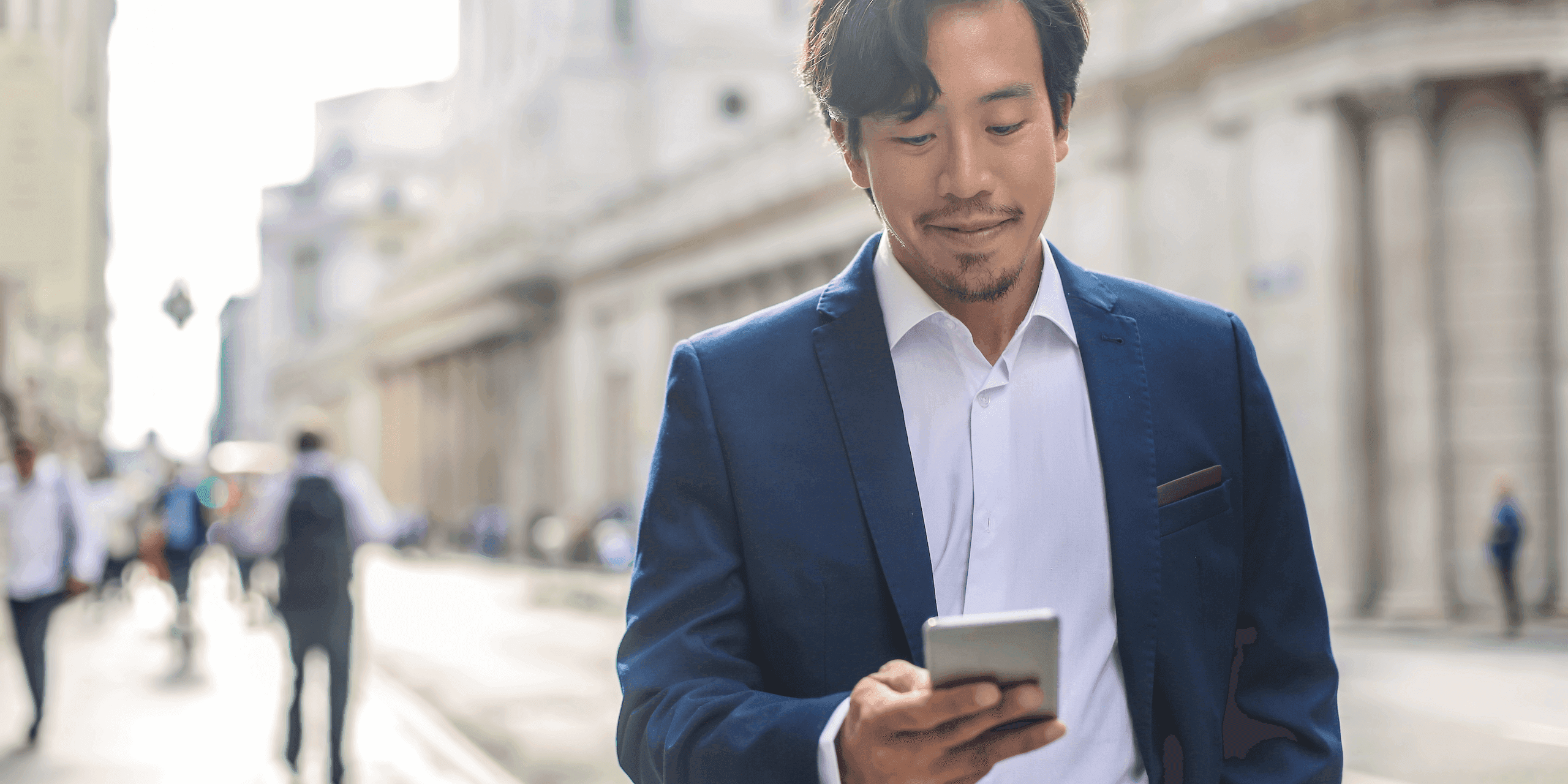 Physician reading on his phone about where patients find doctors online
