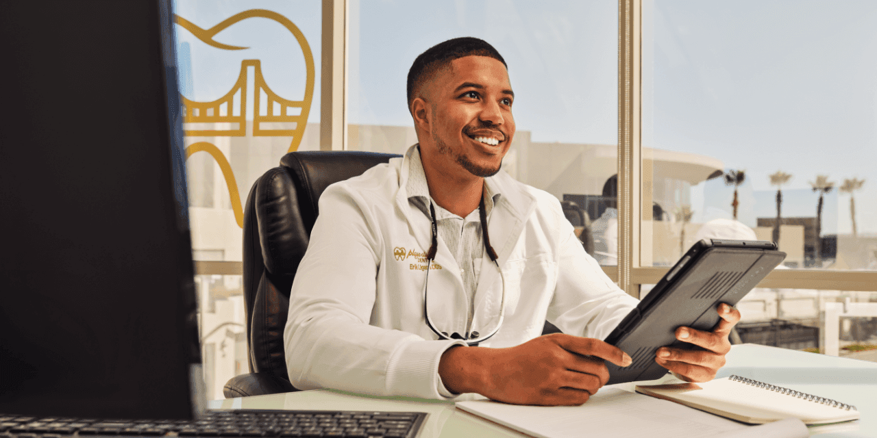 Physician smiling after optimizing images on Google business profile for medical practice.