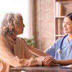 doctor helping patient afford care