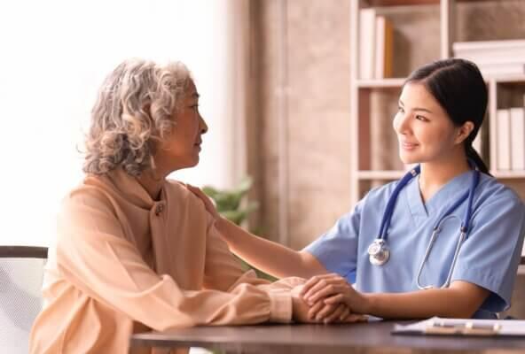 doctor helping patient afford care