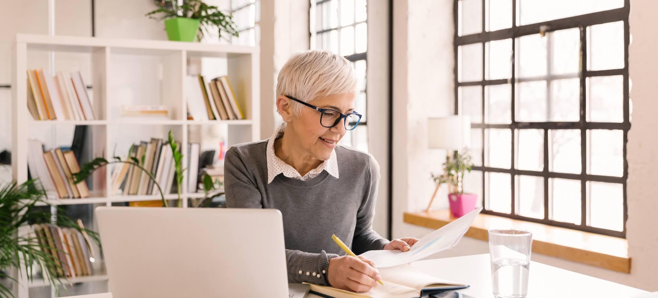 Image of self-employed physician looking at paperwork