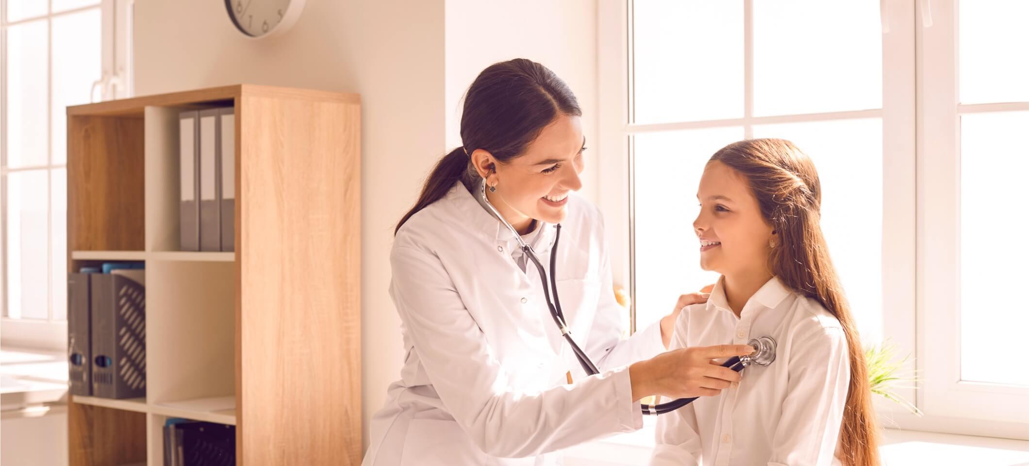 Physician using stethoscope and using clinic equipment on patient