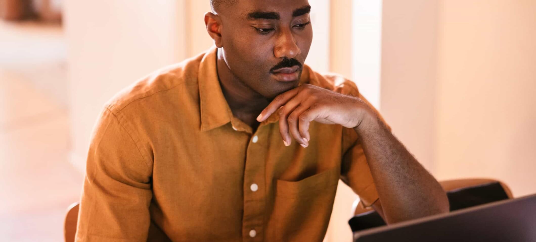 man looking at computer screen