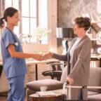 Medical practice staff member talks with patients while using tips to get patients to pay faster