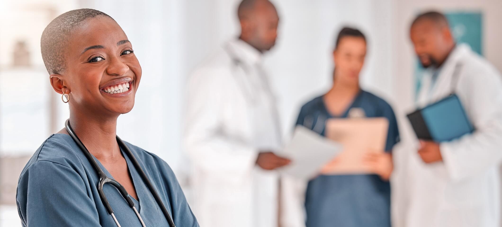 smiling doctor who uses AI medical scribe transcription