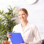 Medical practice manager smiles and talks with patients as part of patient experience program