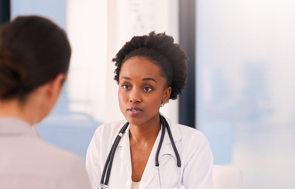 physician speaking with patient preparing for possible medicaid cuts