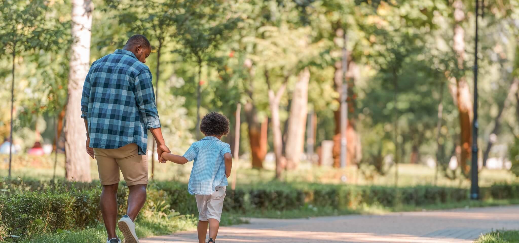 father and child following summer health tips