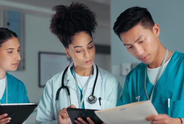 Medical practice team discusses July 2025 RCM healthcare news