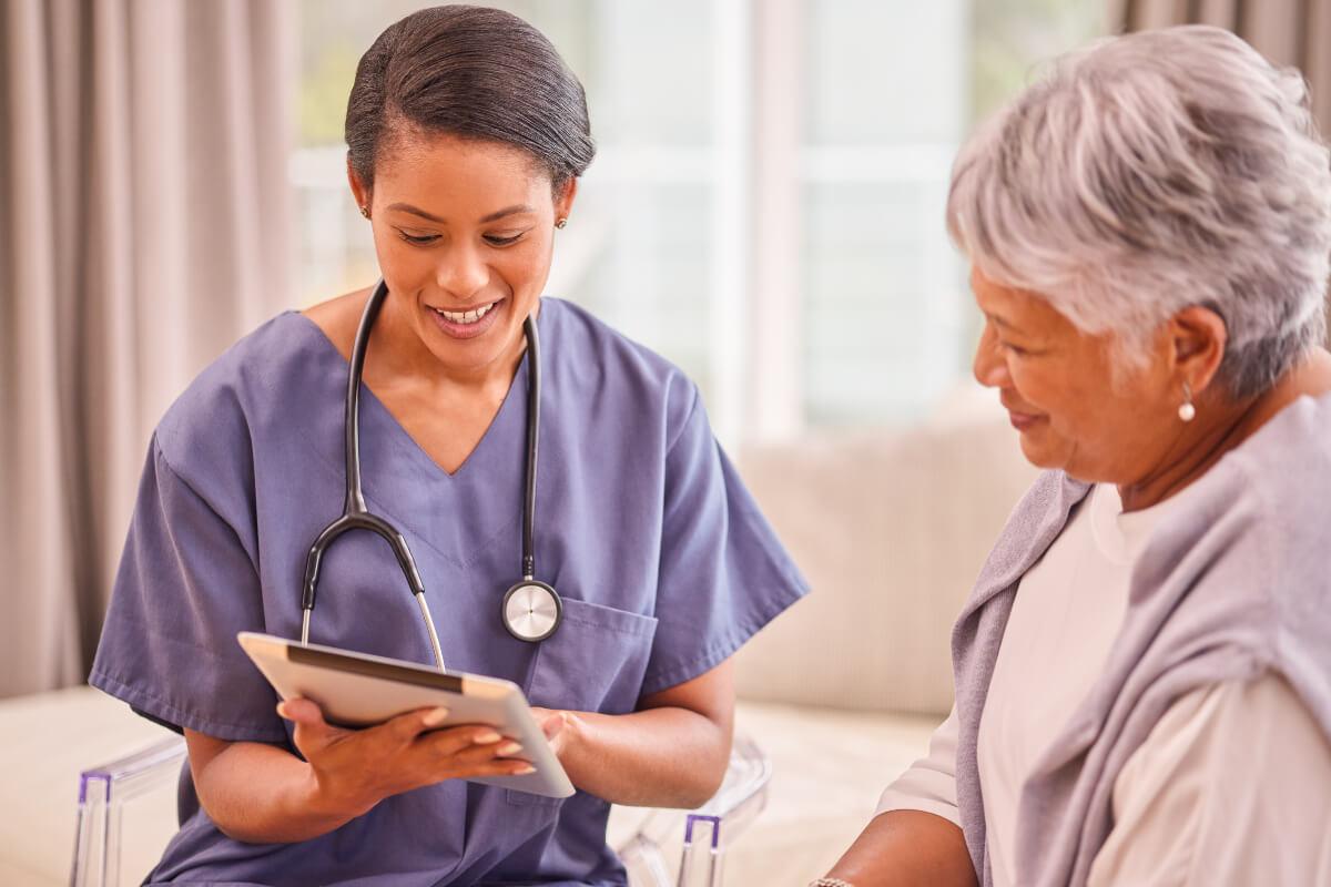 Physician works with senior as part of Healthy Aging Month in September 2025 healthcare observances
