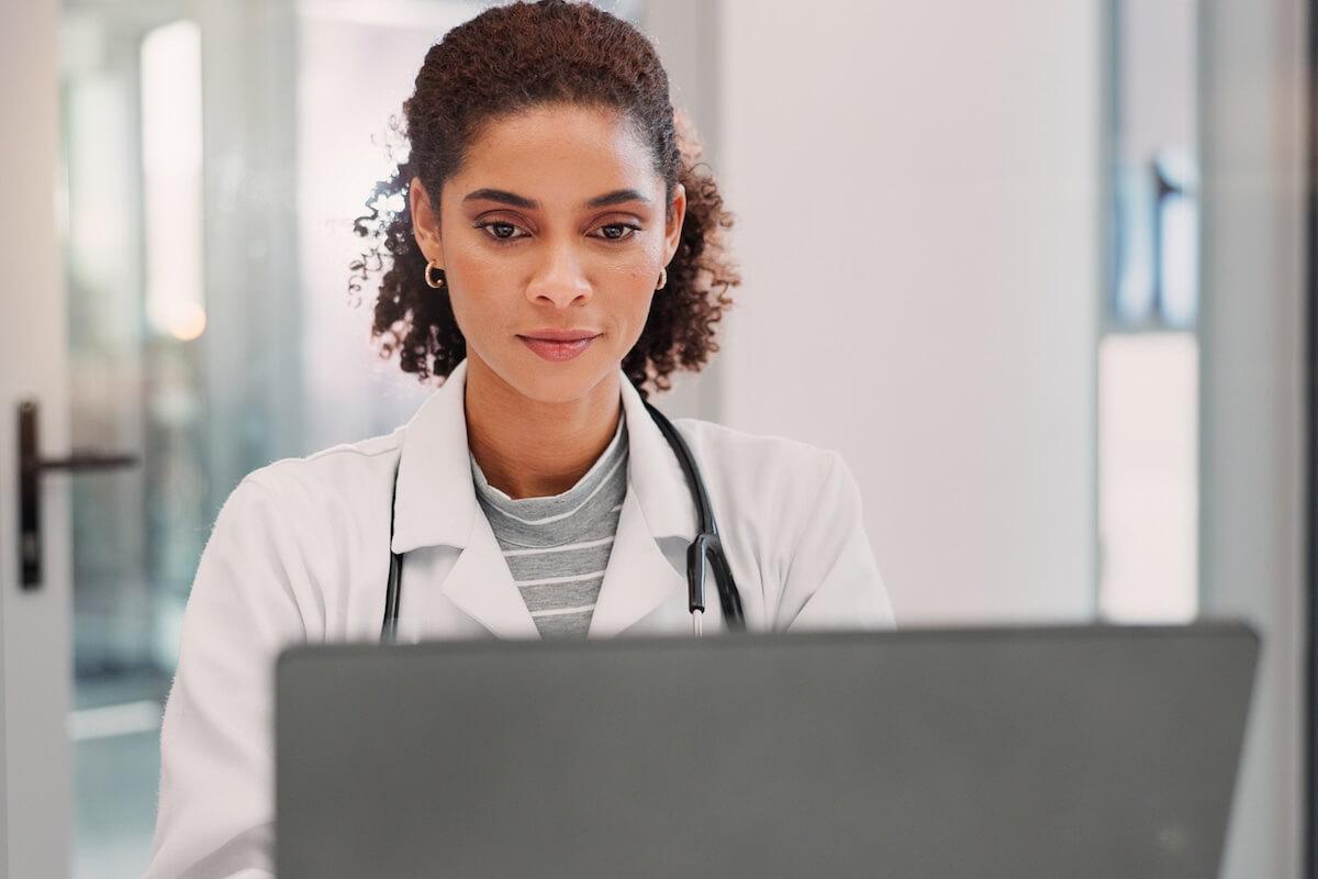 A doctor managing patient reviews with AI.