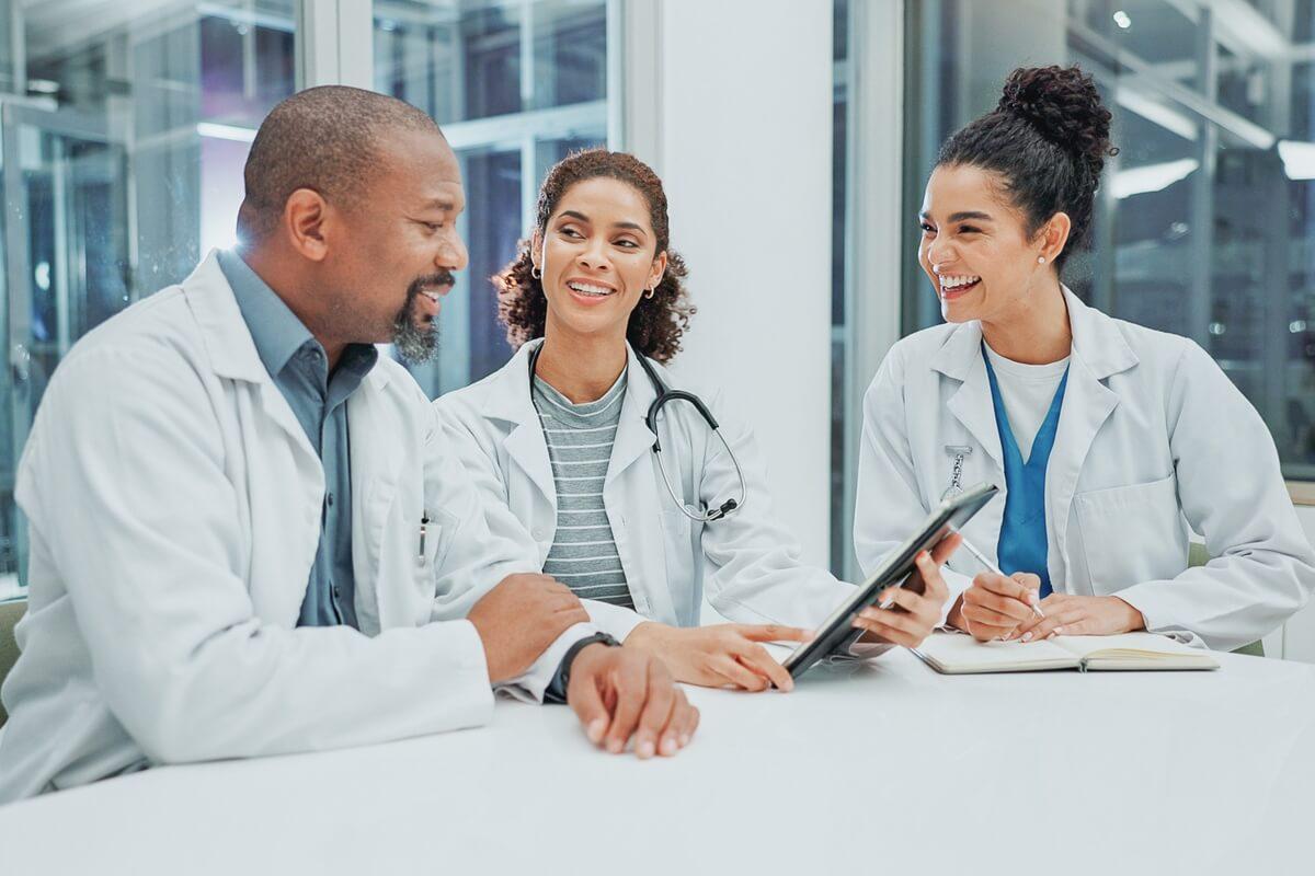 medical practice leaders discussing ways to reduce and reinvest operating costs