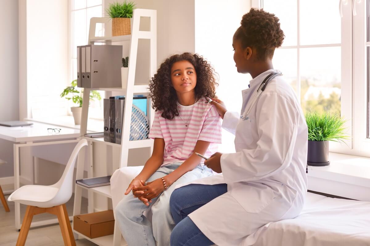 A provider meeting with a patient during an annual wellness visit with E/M code