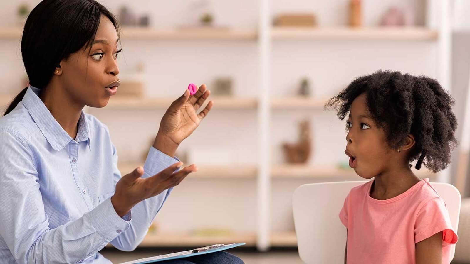 Speech therapist and young girl