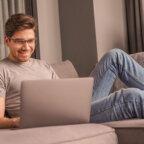 Healthcare practice owner looks at medical practice marketing plan template on computer