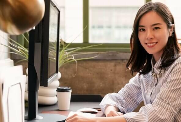 woman smiling after downloading medical billing ideal customer profile template