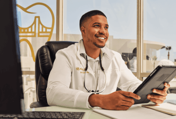 Physician smiling after optimizing images on Google business profile for medical practice.