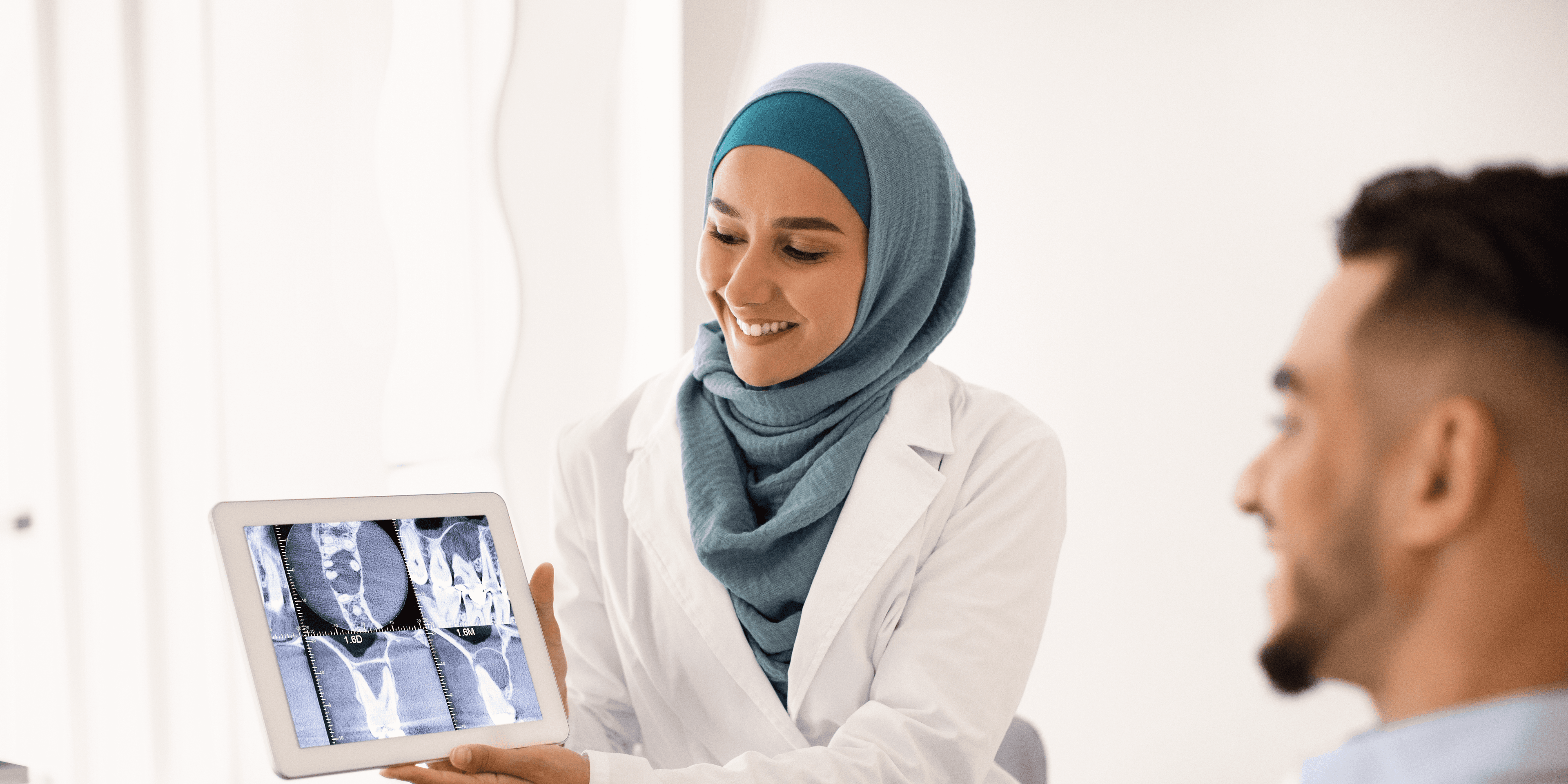 Physician ponders healthcare practice growth while working with a patient