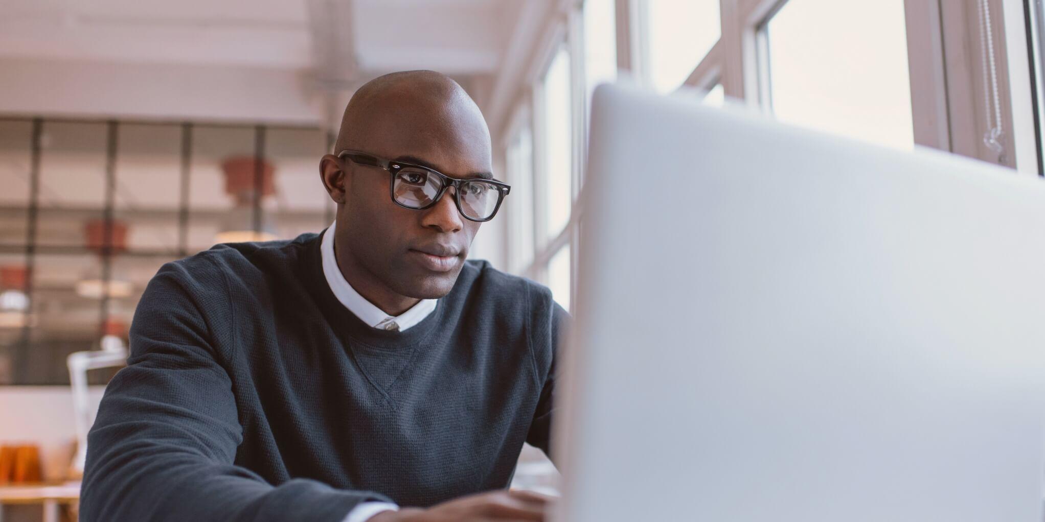 Healthcare professional reads about licenses to start your own medical business