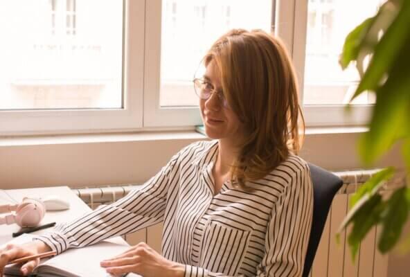 woman researching medical practice permit needs on computer