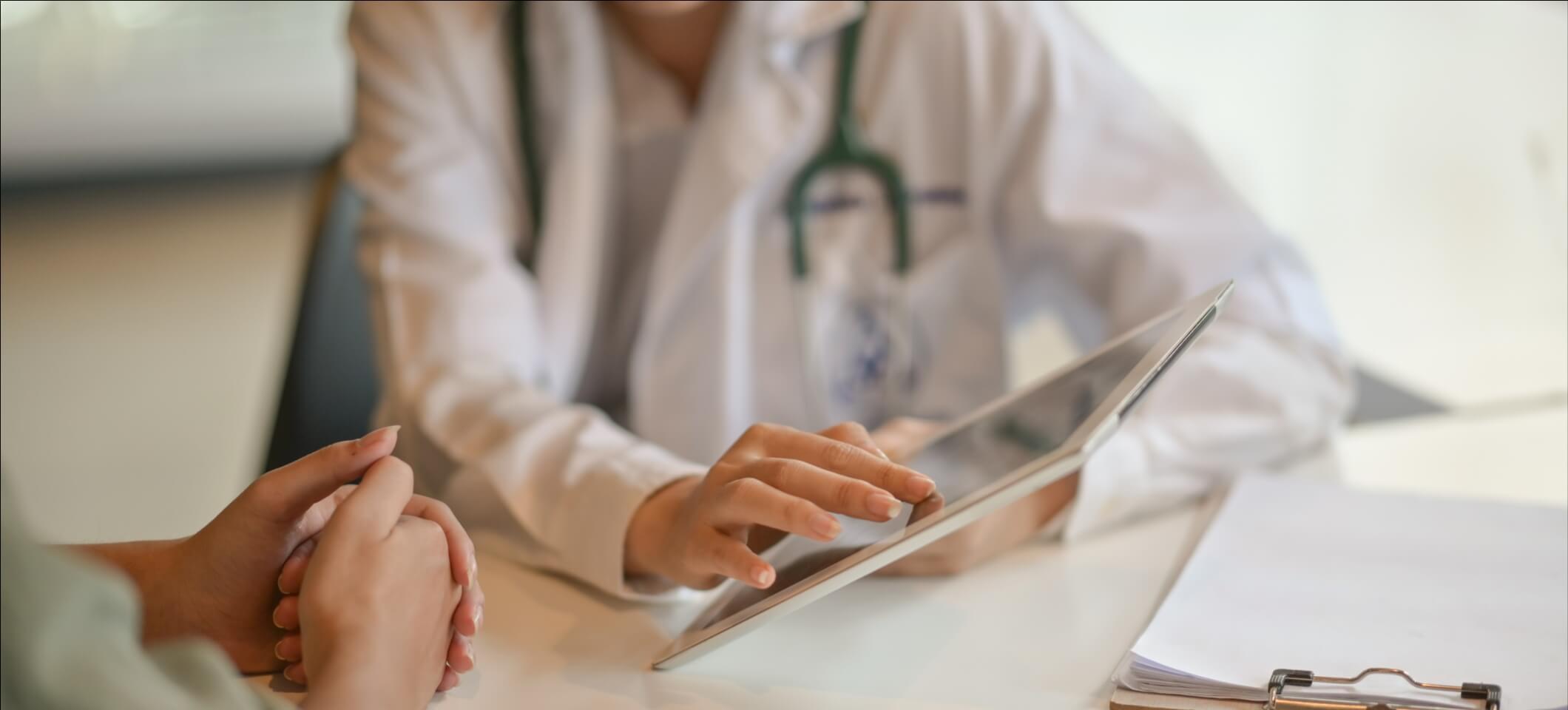 physician using tech to provide patient care