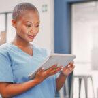a Black doctor using a tablet to take steps to protect patient privacy