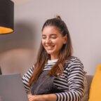 person writing their healthcare professional bio on computer