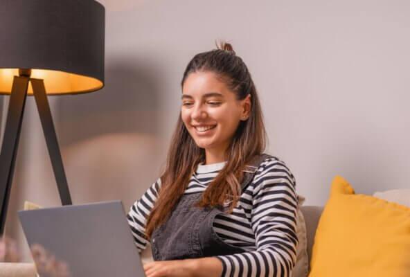 person writing their healthcare professional bio on computer