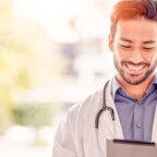 Physician looking at tablet learning about Google My Business for doctors