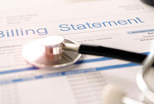 Billing statement and stethoscope with revenue cycle management healthcare news