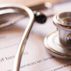 Stethoscope and medical billing documents depict RCM
