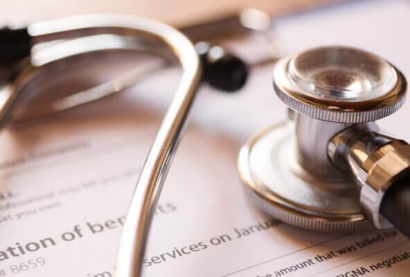 Stethoscope and medical billing documents depict RCM