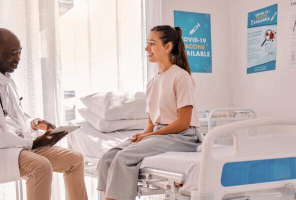 Physician interacts with patient during appointment, building a strong doctor-patient relationship