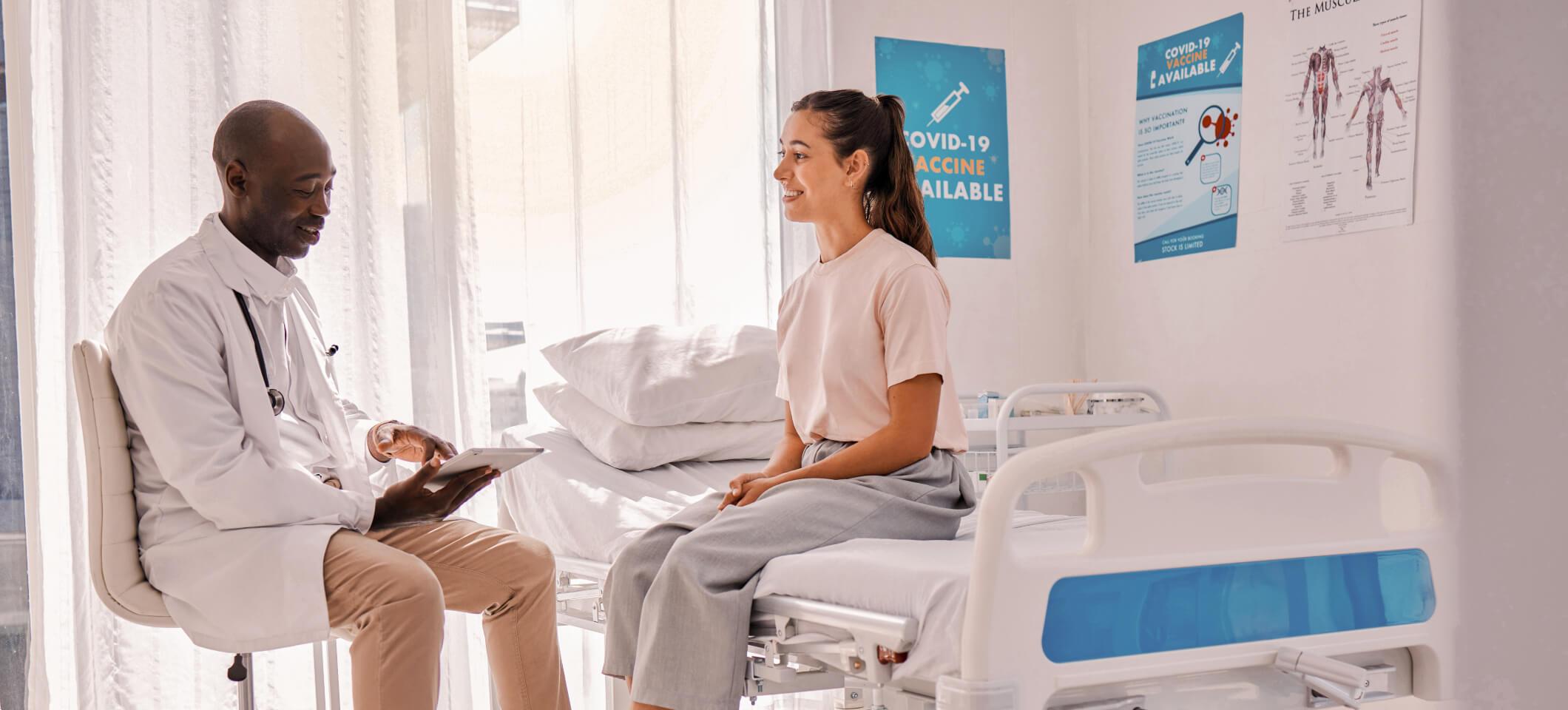 Physician interacts with patient during appointment, building a strong doctor-patient relationship