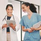 Independent physician and medical staff member discuss marketing budgets for healthcare practices