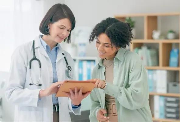 doctors in clinic setting looking at charts together