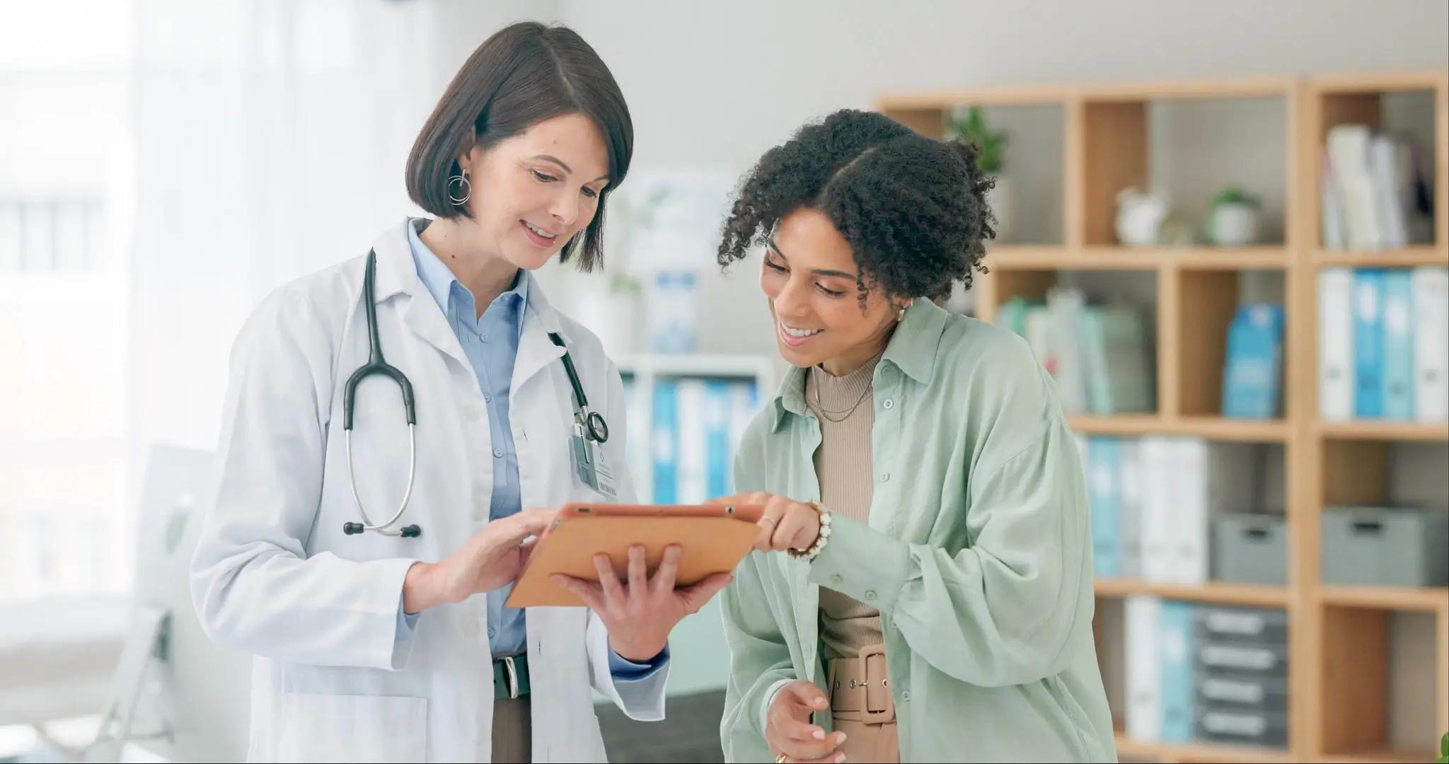 doctors in clinic setting looking at charts together