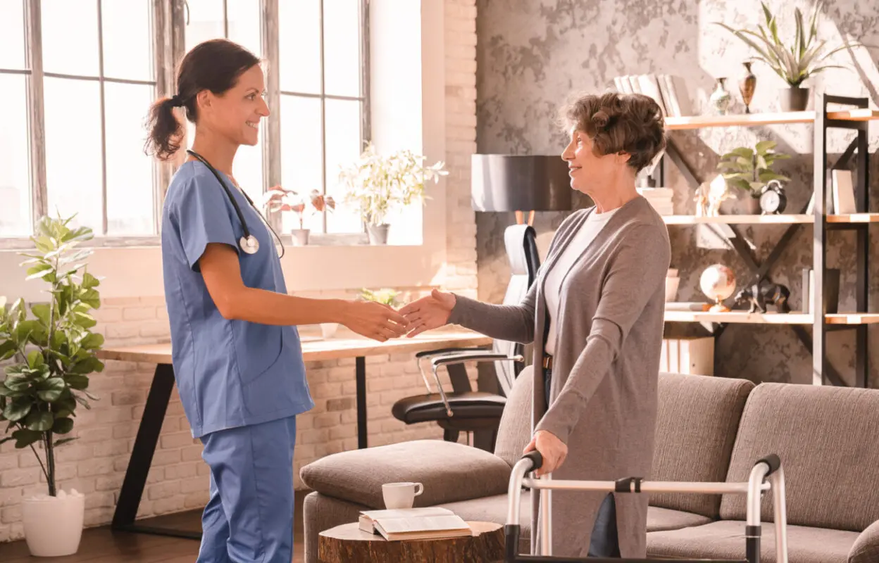 Medical practice staff member talks with patients while using tips to get patients to pay faster