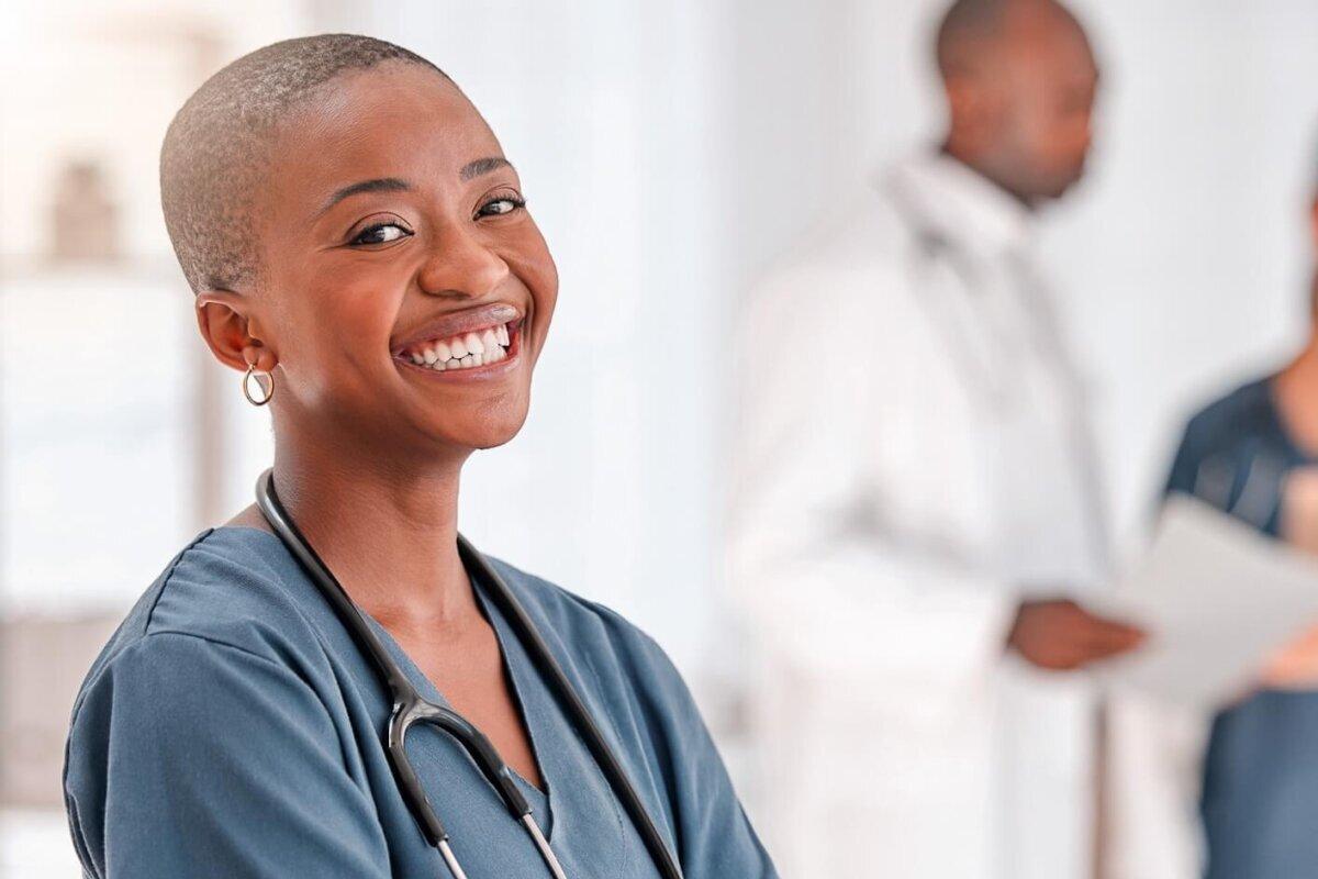 smiling doctor who uses AI medical scribe transcription