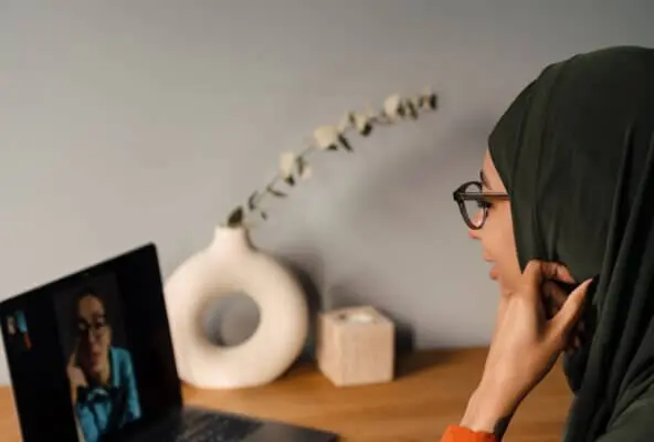a therapist and patient on a telehealth therapy video call