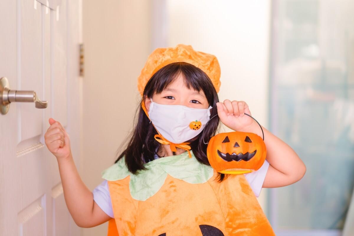 child patient celebrating October healthcare observances