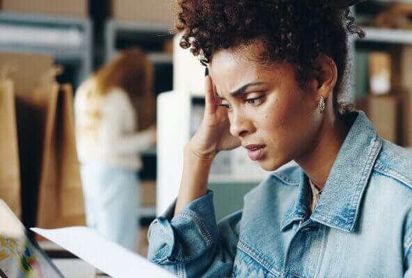 Person looks at medical bill exemplifying the most frustrating digital pain points patients experience