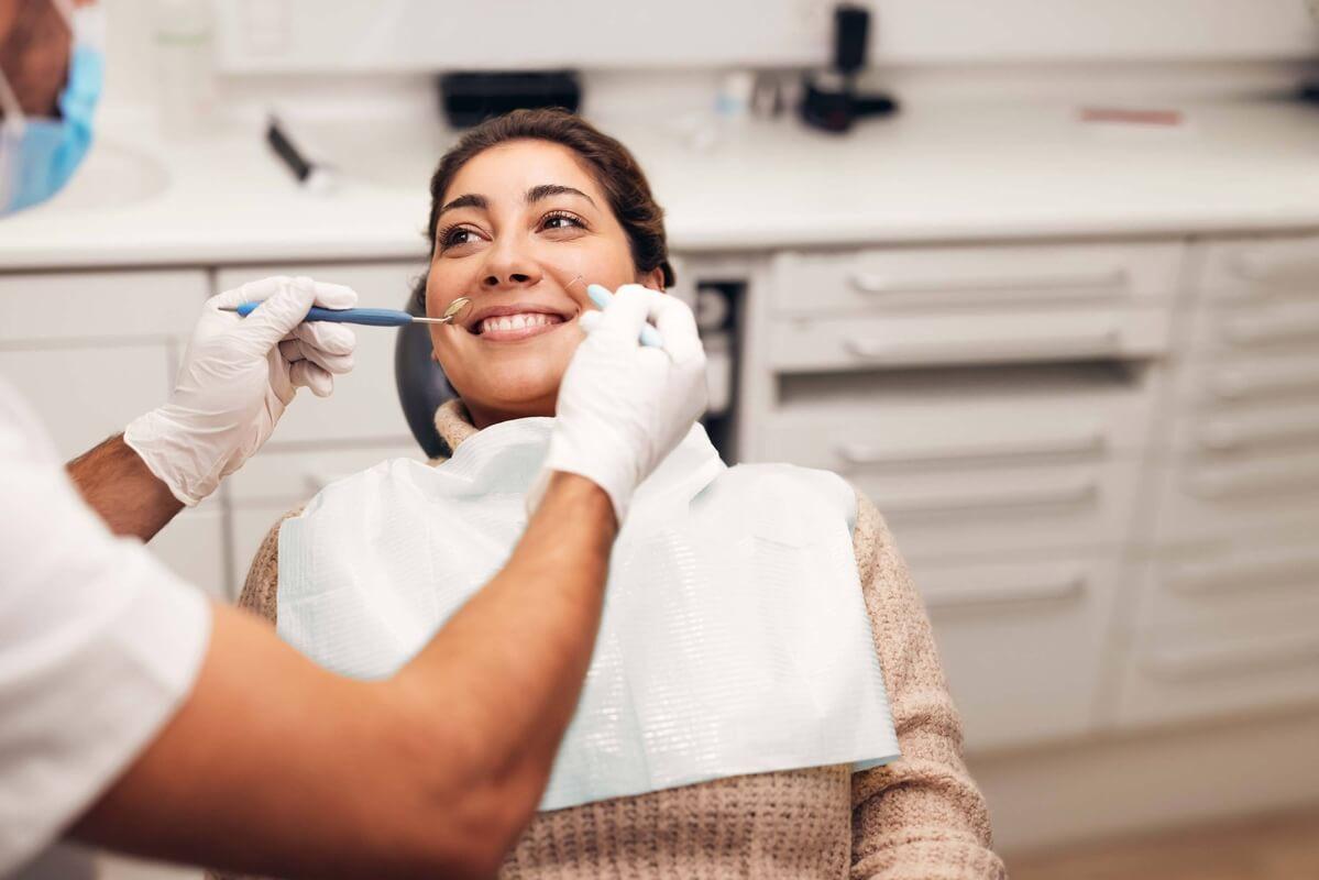 patient coming to dentist after admiring practice’s effective dental website design