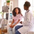 A provider meeting with a patient during an annual wellness visit with E/M code