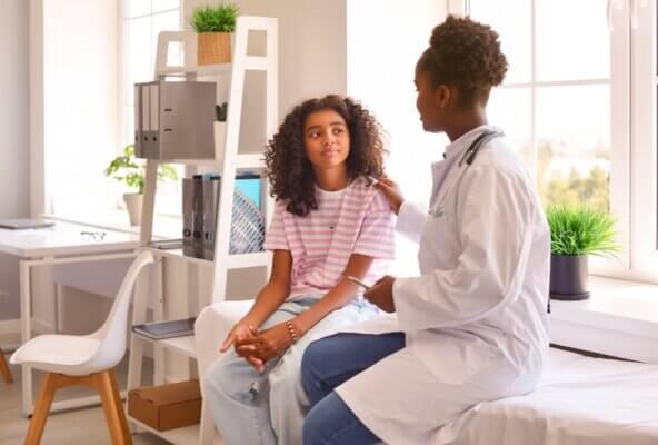 A provider meeting with a patient during an annual wellness visit with E/M code