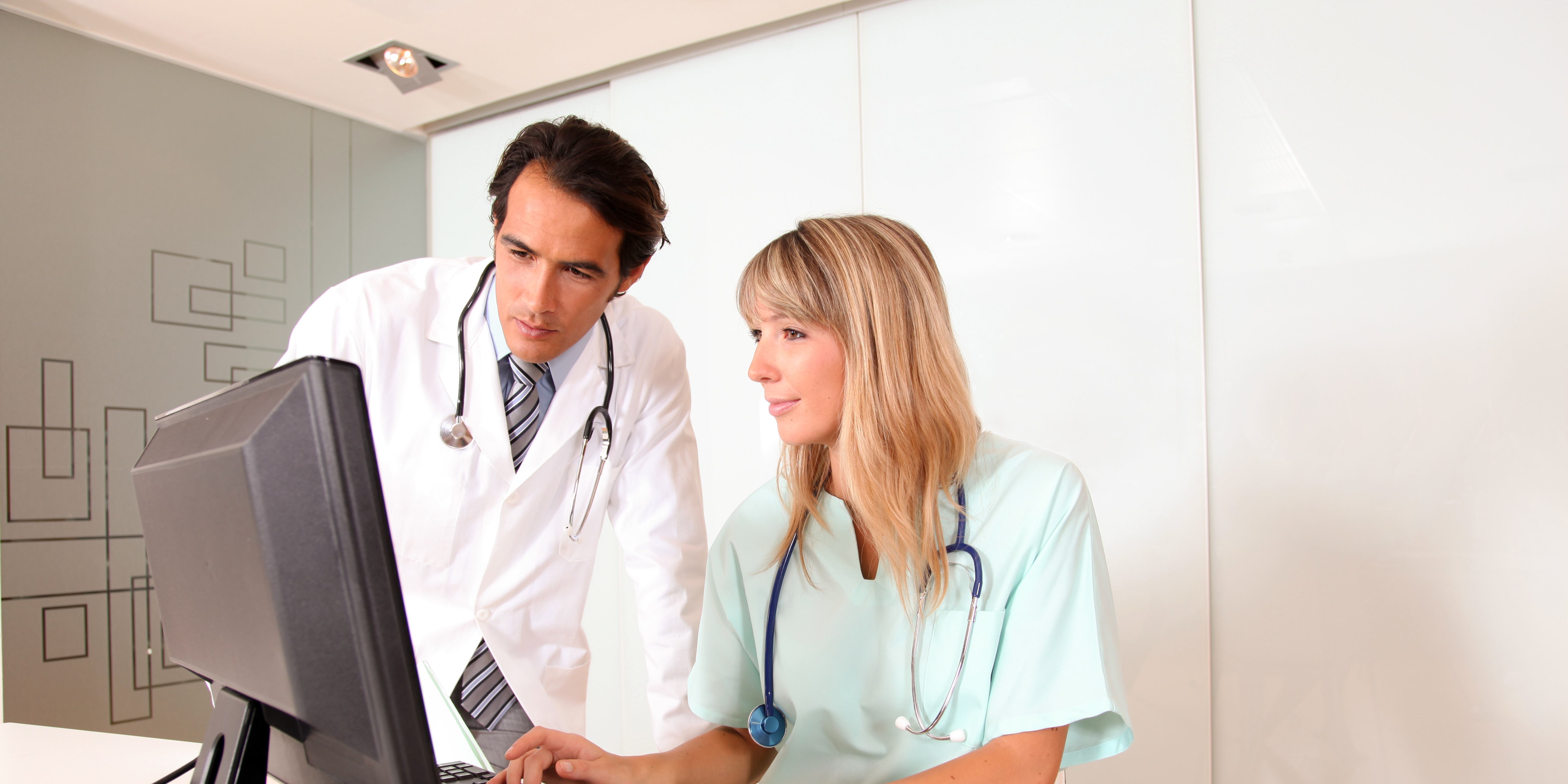 doctor and nurse looking at patient's record